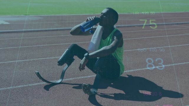 Male runner recovering drinking bottle checking watch tuning blade on sports track with HR overlays