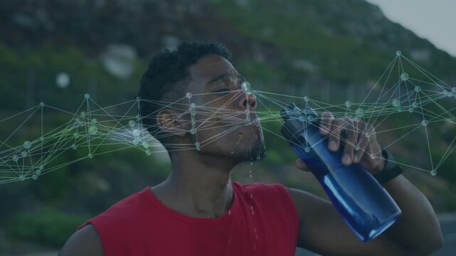 Runner stopping after run sipping blue bottle, faint network overlay tracking fitness hydration