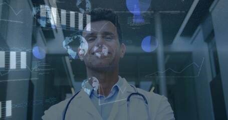 Naklejka premium Standing physician viewing digital overlays in clinic corridor, wearing lab coat and stethoscope