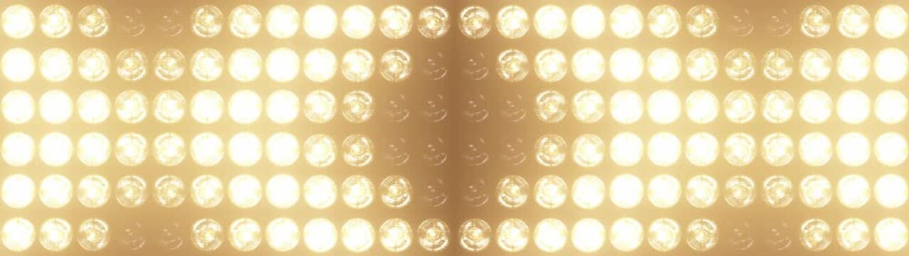 Widescreen flashing lights with bright warm lamps pulsing in patterns, perfect for music videos, club events, and show intros, concert visuals and dynamic stage backgrounds	
