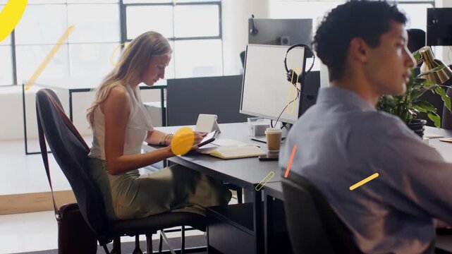 Woman at desk placing phone aside, opening tablet in office, animated shapes marking files, sharing