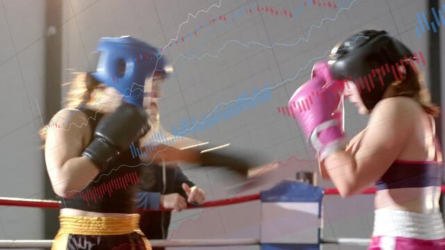 Two female boxers sparring in boxing ring after sizing each other up, trading jabs for training