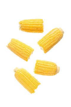 Cut fresh corn cobs on white background