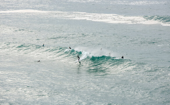 Surfer or bodyboarder in the big waves of Cantabria in Spain.