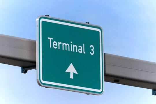 Close-up of green direction sign Terminal 3 at German Frankfurt Airport on a sunny spring day. Photo taken April 25th, 2026, Frankfurt am Main Airport, Germany.