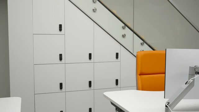 Charming White Finish Complements Functional Modular Lockers Beneath Staircase With Key Compartments. Creative