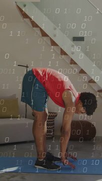 Vertical video: Man folding forward from standing on blue mat for fitness, binary overlay appearing