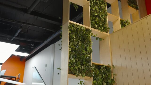 Vertical Plant Installation With Wooden Separators And Lush Foliage Creating Warm Indoor Environments. Creative