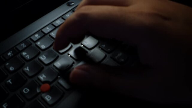 Hand pressing keyboard keys on laptop, data entry, typing and work tasks, technology office tools,wfh