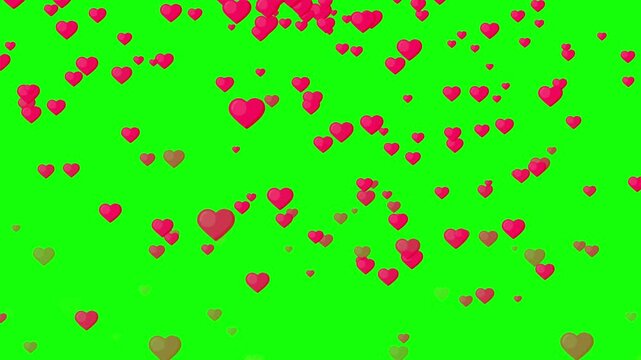 Pink hearts float gently on a vibrant green screen