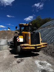 Fototapeta premium Yellow Front Loader on a Construction Site