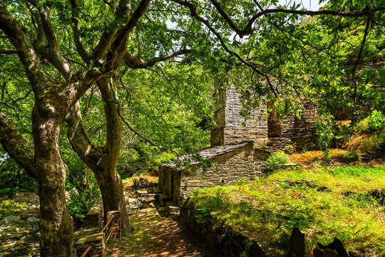 Old watermill building of Aris by river at fishing coastal village of Karavostamo on Ikaria island, Greece