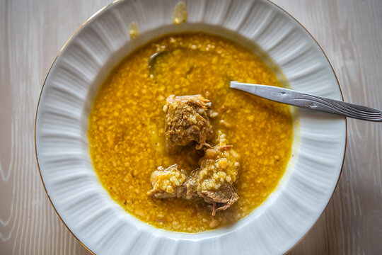 Trachano soup traditional Ikarian food dish from sour trahana fermented grain goat milk longevity diet with onion olive oil in Ikaria Greece