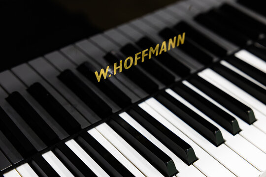 Close up of W.Hoffmann piano keyboard with golden logo