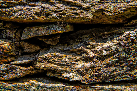 Ancient Greek slate flat stone rock wall, stacked flat stones plates stimata in Ikaria, Greece of Aegean island ancient old architecture schist