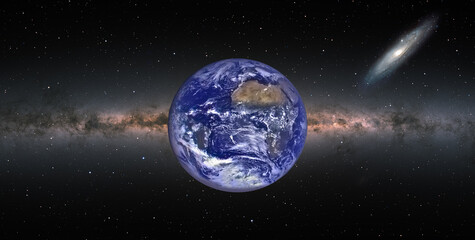 Fototapeta premium Planet Earth with Milky Way and Andromeda galaxy in the background - 
