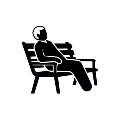 Fototapeta premium Man sitting on a park bench relaxing.