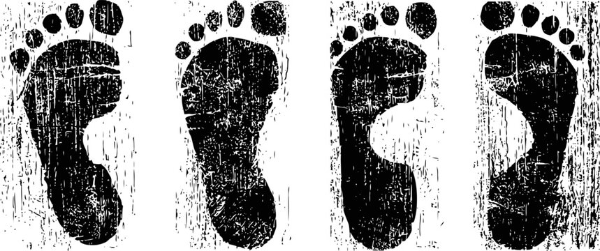 black grunge footprint set with textured rough edges isolated on white background