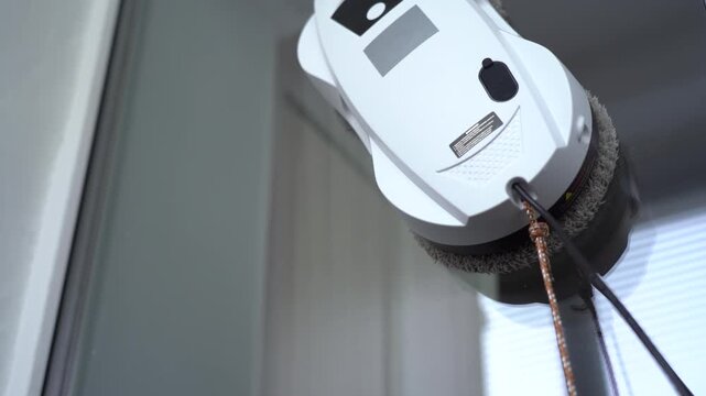 Automated Window Cleaning Robot in Action: Effortlessly Removing Dirt and Grime from Glass Surfaces with Advanced Technology