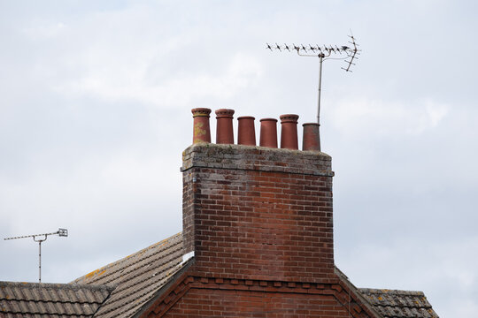 Red clay chimney with TV aerial