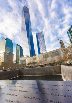 New York, United States - April 11, 2026: View from National September 11 Memorial, looking across the bronze parapets inscribed with names of victims
