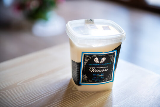 Ikaria Island, Greece - June 14, 2023: Mastic gum, mastica sweet dessert Greek food of sugar in plastic container by Teskov brand, Ikaria Greece