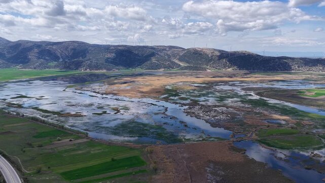 This panoramic drone shot, which captures the unique natural beauty of the Afyon Karakuyu Marshes, their winding wetlands, and the wind turbines on the horizon, blends tranquility with ecology.