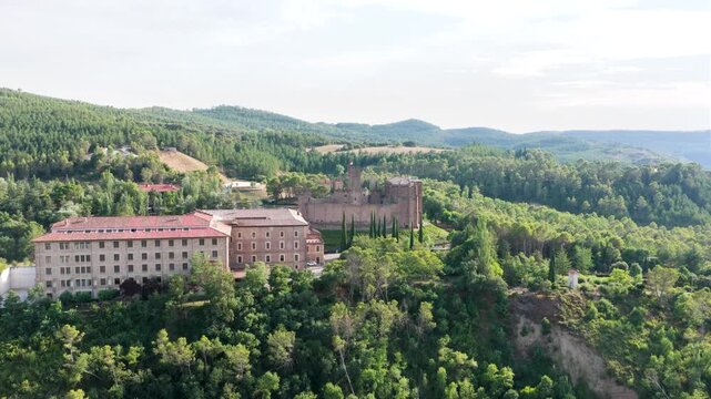 Aerial view of the historic javier castle surrounded by lush green forest. This medieval fortress is a famous landmark in navarre, spain