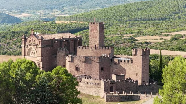 Majestic aerial view of the historic javier castle and basilica. This medieval fortress is a prominent landmark in the navarre region of spain