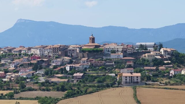 Majestic view of the medieval village of Berdun in the province of Huesca, Spain. The beautiful town is surrounded by golden wheat fields