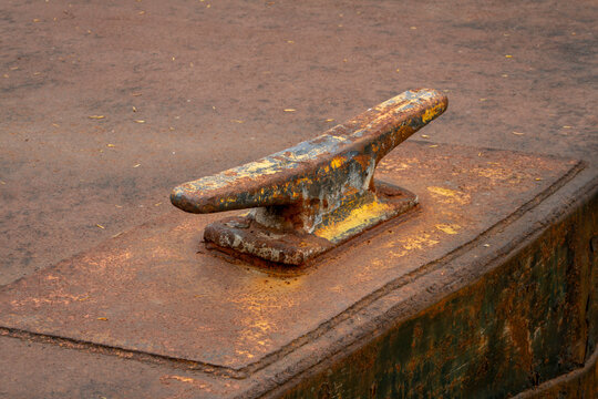 rusty cleat on a deck of vintage river dredge or barge