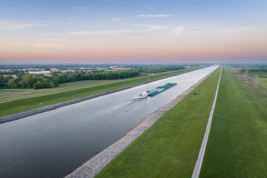 towboat with barges on Chain of Rocks Canal of Mississippi River above St Louis - aerial view
