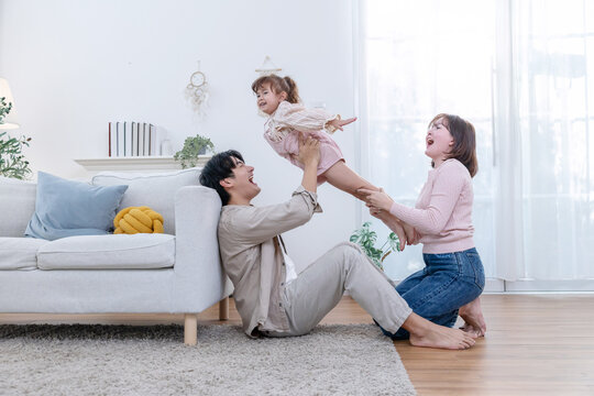 Family sharing joyful moments together in living room