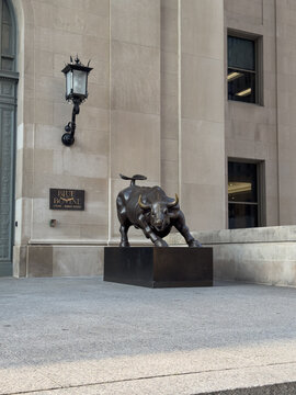 Toronto, Ontario, Canada, June 14, 2025: Blue Bovine bull sculpture located outside the main entrance of Union Station in downtown Toronto, near the Blue Bovine Steak and Sushi restaurant.