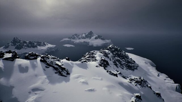 snow covered peaks under brooding sky, distant icy islands looming over dark sea, windswept cornices and scattered rock outcrops, dramatic low light