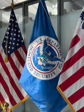Mississauga, Ontario, Canada, June 16, 2025: Toronto Pearson International Airport. Airport's U.S. Customs and Border Protection preclearance area, with flags from Canada, USA, and the US DHS.