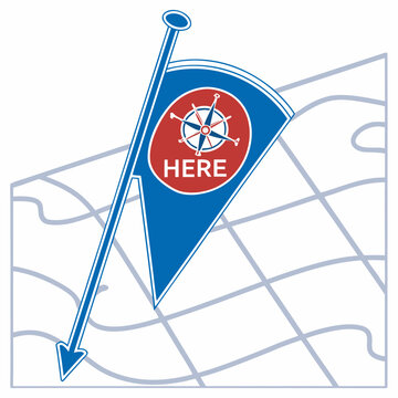 Blue flag with compass and here text on a map navigation direction