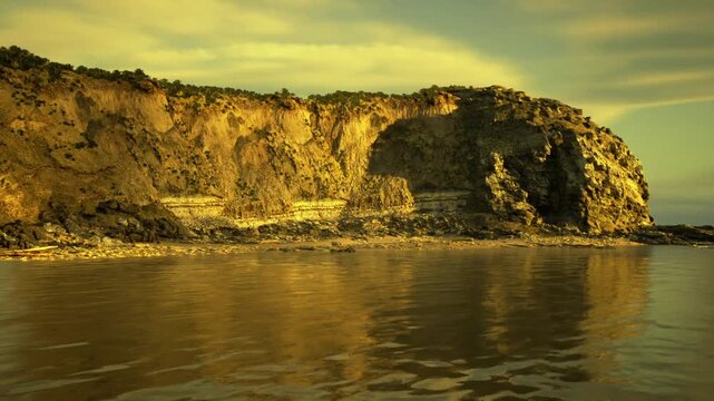 stormy cliff over choppy sea, dark clouds gather, waves crash against rocky base, windblown spray and foreboding mood for adventure or weather reportage