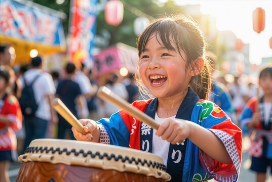 Close up of energetic Japanese girl in happi coat playing Taiko drum