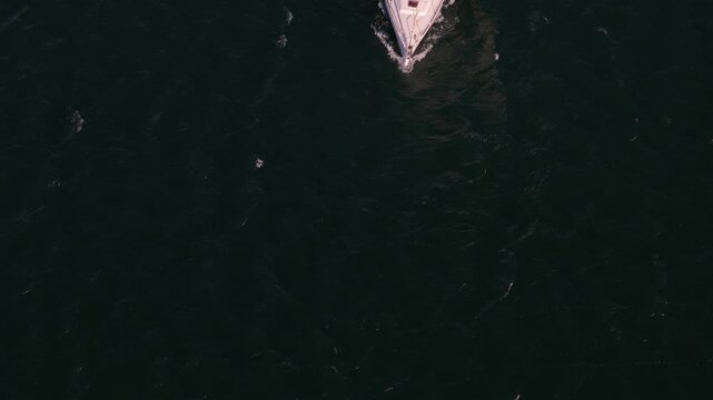 Cascais, Portugal - 27 March 2026: Aerial view of deep blue ocean water with small ripples and gentle waves on the surface.