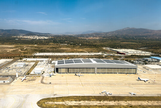 Aerial view of aircraft maintenance hangar and runway in Athens international airport, Greece