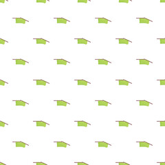 Fototapeta premium Seamless pattern featuring green knitted fabric with needles against a white background