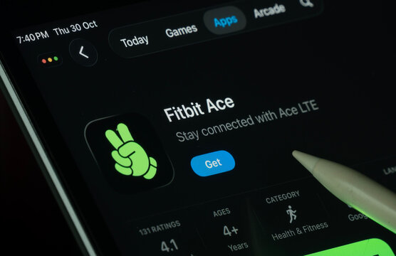 Dhaka, Bangladesh- 30 Oct 2025: fitbit ace app displayed on a iPad screen in dark mode with a digital pen pointing at it.