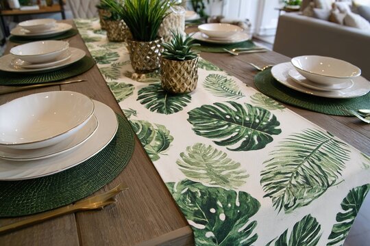 tropical palm leaf print table runner with green mats