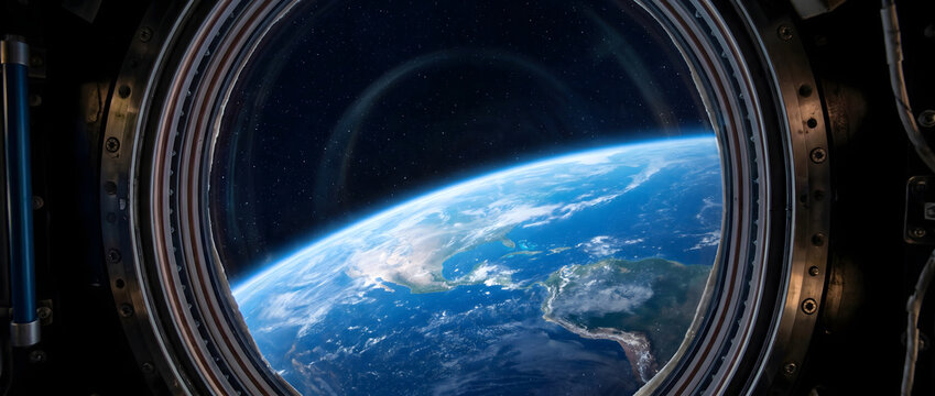 View of Earth's curvature through a spacecraft porthole showing blue and white planetary surface against deep space