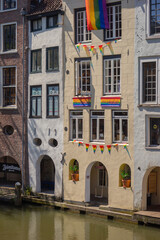 Fototapeta premium Rainbow Flags on Historic Canal Houses Along Oudegracht in Utrecht