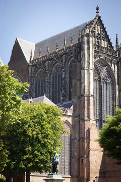 Gothic Dom Church Facade and Bronze Statue in Historic Utrecht City Center