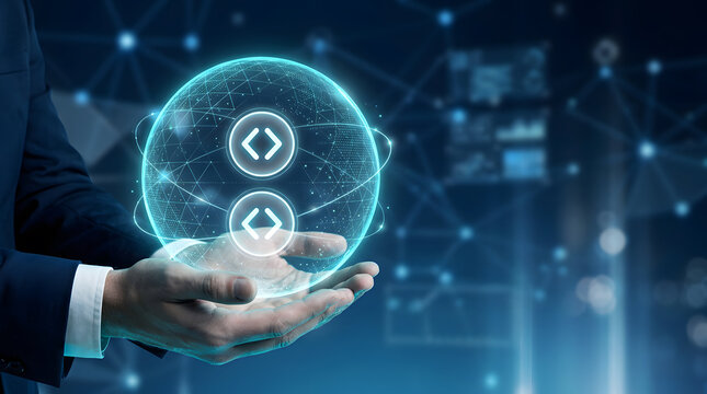 Business hands holding holographic digital globe with code brackets symbol and network connection