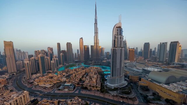 Night to day time lapse view of the Downtown Business Bay district skyline of Dubai, UAE