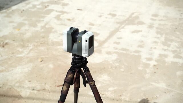 White laser scanner mounted on tripod